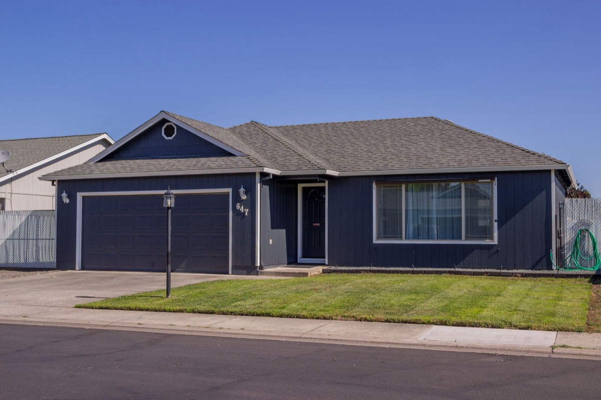 Single-story ranch home with a fresh lawn, listed after prep work