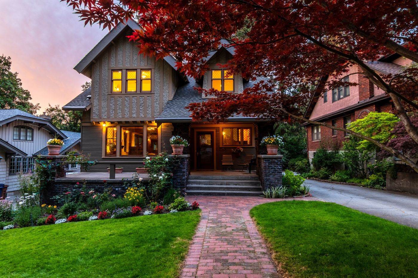 House at twilight with the lights on at the end of another season
