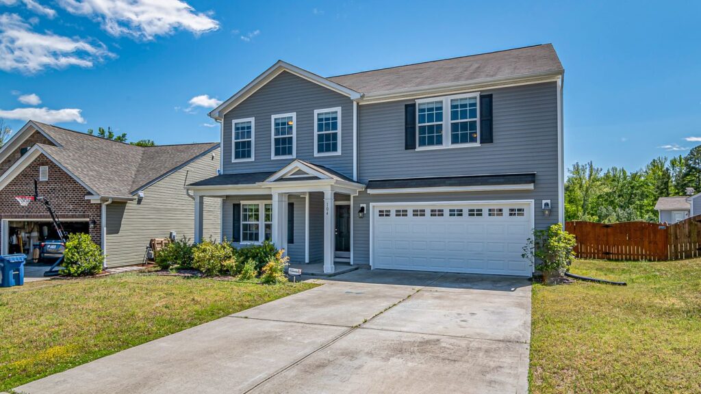 Spacious two-story house with attached garage in a peaceful neighborhood.