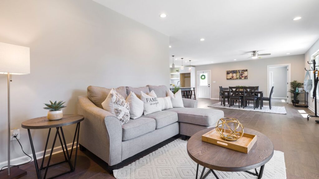 Spacious modern living room featuring stylish furniture and neutral decor.